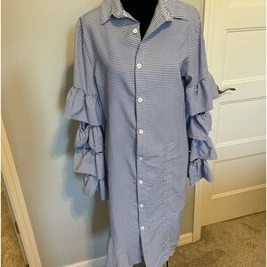 Shirt dress has ruffled sleeves and Beachy vibe